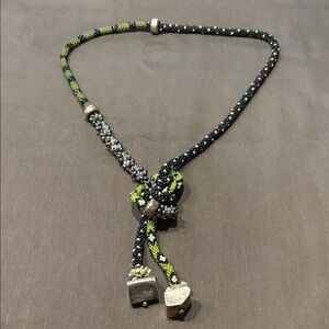 Woven bead necklace with silver detail.